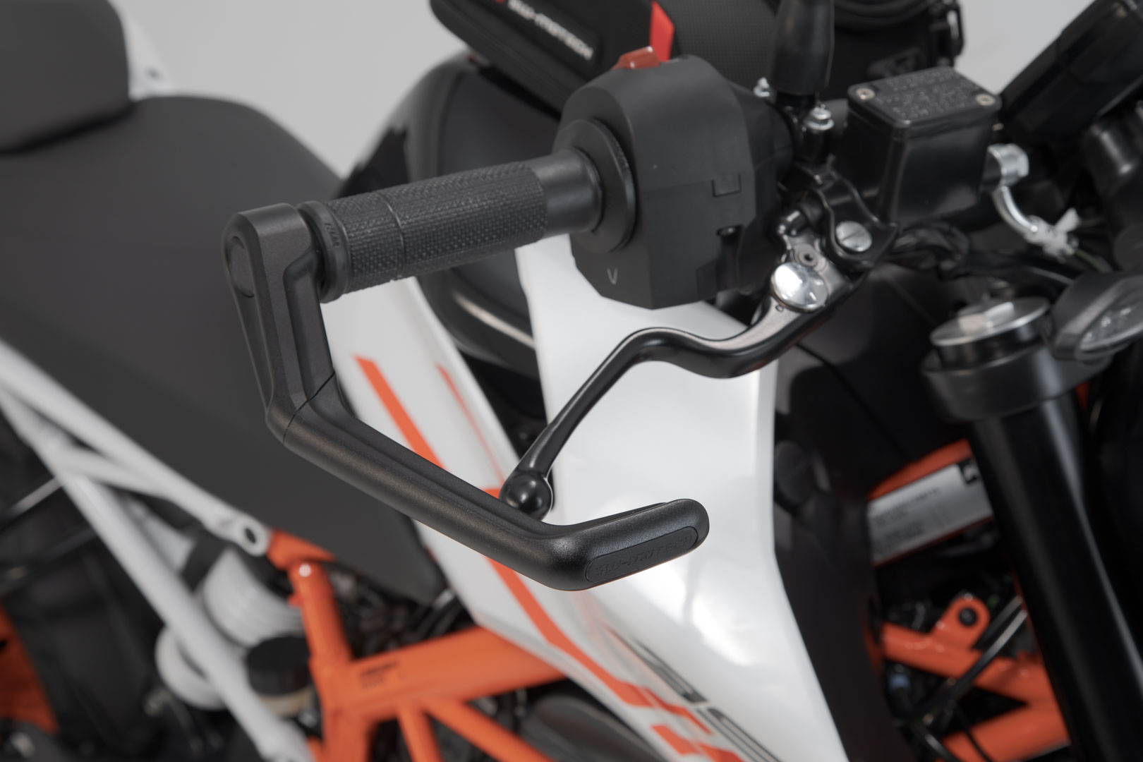 Side view of SW-Motech Lever guards - Black. Ducati / KTM / Aprilia / Honda / Yamaha.