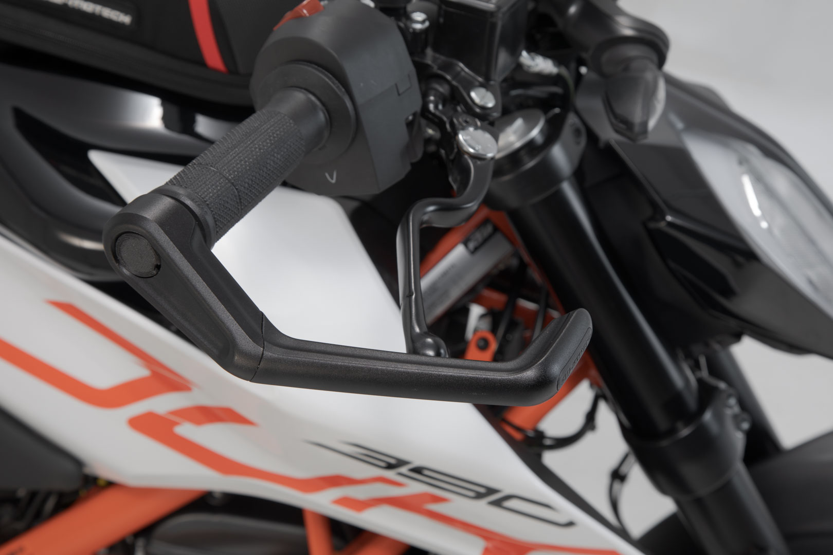 Side view of SW-Motech Lever guards - Black. Ducati / KTM / Aprilia / Honda / Yamaha.