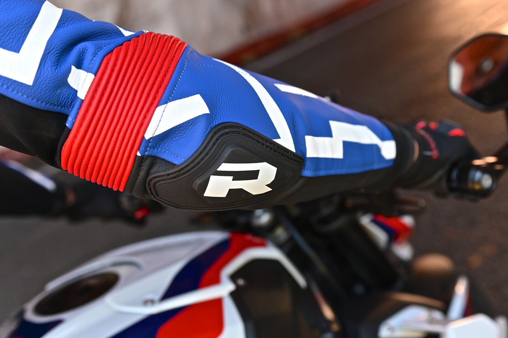 Side view of Richa Stradale perforated Motorcycle Leather Jacket, black-white-red-blue, Size 58 for Men