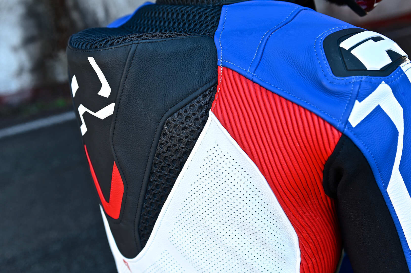 Side view of Richa Stradale perforated Motorcycle Leather Jacket, black-white-red-blue, Size 58 for Men