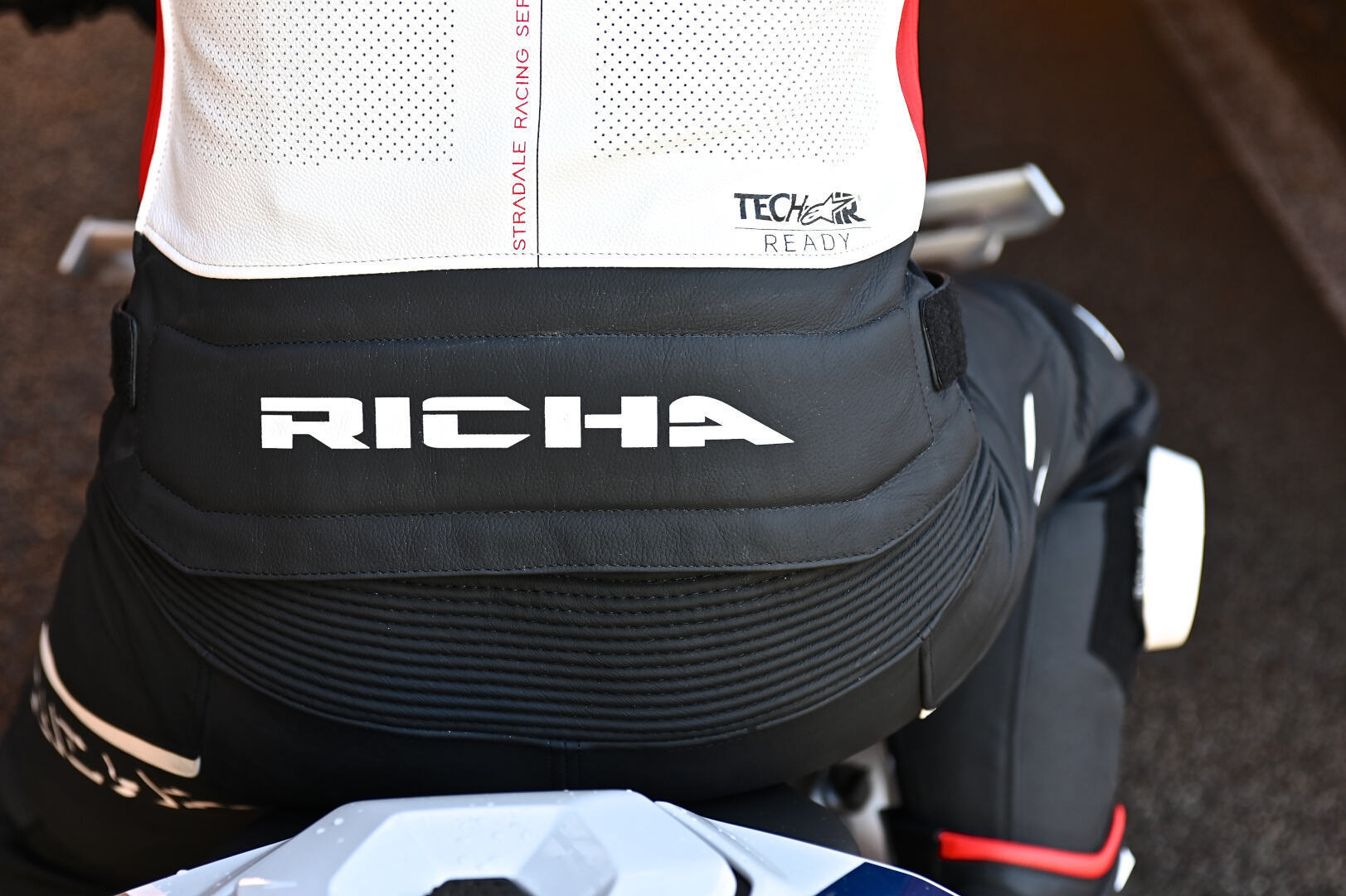 Side view of Richa Stradale perforated Motorcycle Leather Jacket, black-white-red-blue, Size 58 for Men