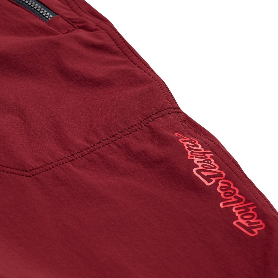Side view of Troy Lee Designs Skyline Trail Shell Mono Bicycle Shorts, red, Size 34 for Men