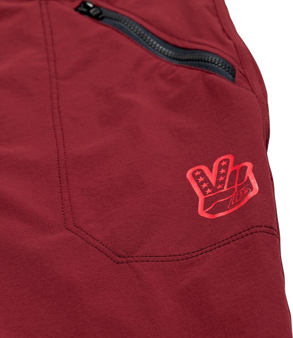 Side view of Troy Lee Designs Skyline Trail Shell Mono Bicycle Shorts, red, Size 34 for Men